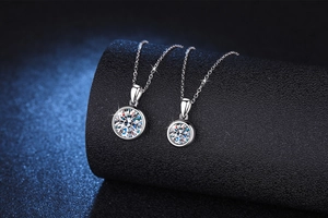 Macro shot of two S925 sterling silver moissanite bubble necklaces on black stands