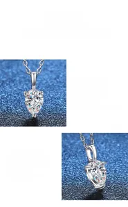 Close-up of teardrop-cut moissanite pendant with polished silver finish and link chain