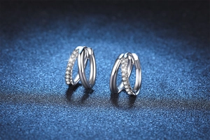 Close-up of S925 silver double hoop earrings featuring pavé moissanite and a polished finish