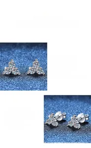 Macro shot of S925 sterling silver moissanite earrings with leaf petal-shaped clusters