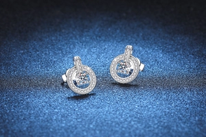 Macro view of S925 silver stud earrings with 1ct moissanite and halo diamond setting