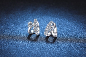 Close-up of S925 sterling silver asymmetrical hoop earrings with brilliant Moissanite stones