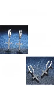 Detailed view of 925 silver moissanite cross earring with polished finish