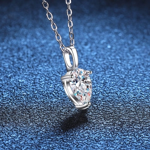 S925 silver necklace with 1ct pear cut moissanite pendant on blue glitter background