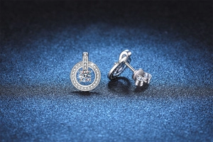 Macro detail of S925 sterling silver moissanite stud earring with halo pavé setting