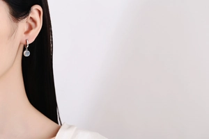 Close-up of elegant S925 sterling silver hoop earrings with 1 carat Moissanite stones