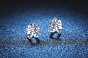 Macro shot of S925 sterling silver moissanite earrings with double-layered arc design
