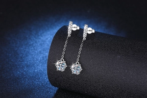 Macro shot of S925 silver long tassel earrings with brilliant one-carat moissanite stones
