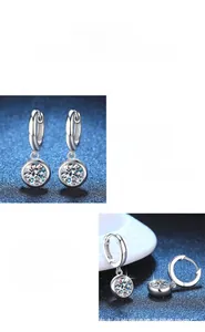 Detailed macro view of S925 silver moissanite earrings with brilliant circular cut stones
