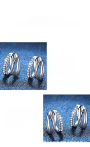 Macro detail of S925 sterling silver hoop earrings with pavé moissanite stones