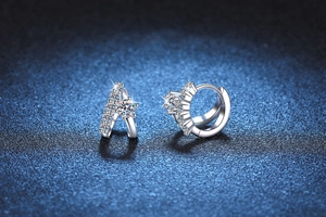 Macro detail of S925 sterling silver asymmetrical earrings with brilliant D color moissanite