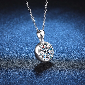 Elegant S925 sterling silver moissanite necklace with round cut stone on blue texture