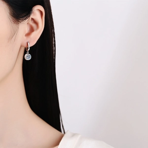 Elegant S925 sterling silver hoop earrings featuring 1 carat moissanite solitaire pendants