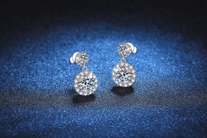 Macro view of S925 sterling silver drop earrings with halo-set moissanite stones