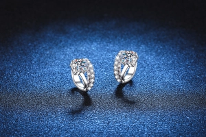 Macro shot of S925 sterling silver hoop earrings with D color Moissanite and side stones