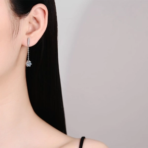 S925 sterling silver moissanite tassel earrings with six-prong round cut stone on model