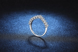 Macro detail of V-shaped S925 sterling silver ring with sparkling moissanite stones
