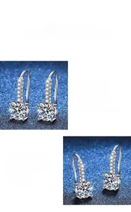 Détail macro de boucles d'oreilles moissanite avec crochet français et pavé