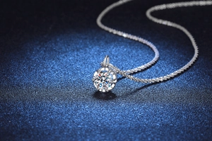 Macro shot of S925 sterling silver crown necklace with brilliant moissanite pendant