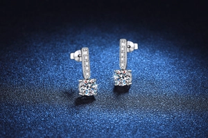 Detailed macro shot of S925 sterling silver studs featuring a 1-carat moissanite stone