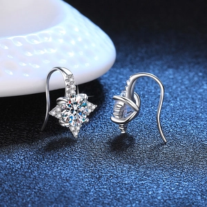 Elegant S925 sterling silver star-shaped moissanite earrings on dark blue background