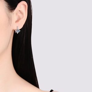 Elegant s925 silver star drop earrings with moissanite center on female model