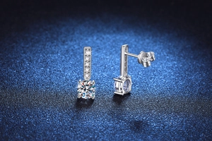 Macro shot of S925 sterling silver drop earrings with brilliant moissanite and pave stones