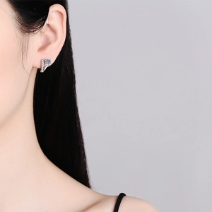 Minimalist S925 sterling silver hoop earrings with a round D color moissanite diamond