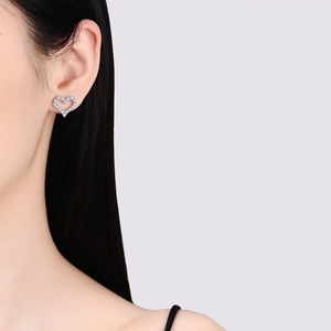 Elegance S925 sterling silver heart-shaped moissanite stud earrings on model