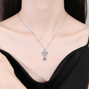 S925 sterling silver fleur-de-lis crown necklace with 1 carat moissanite on a model