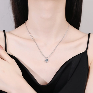 Elegant S925 sterling silver crown moissanite pendant necklace on a female model
