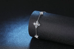 Macro detail of S925 silver four-leaf clover bracelet with 1.2ct moissanite stones