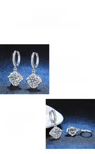 Détail de créoles en moissanite avec polissage classique allemand et diamants fins