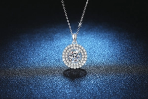 Detail of round S925 sterling silver necklace with double halo Moissanite stone