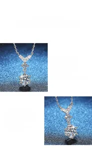 Macro shot of V-shaped silver pendant with premium moissanite and intricate pavé setting