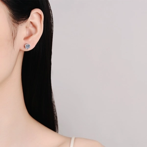 S925 sterling silver six-prong moissanite stud earring worn on ear for minimalist look