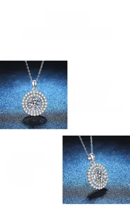 Close-up detail of double halo moissanite pendant with a classic silver link chain