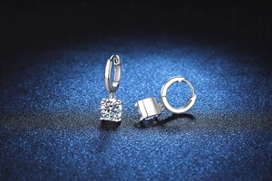 Detailed macro view of S925 sterling silver hoop earrings with square-cut moissanite stones