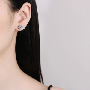 S925 sterling silver snowflake earrings with round Moissanite on a female ear model