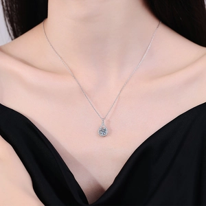S925 sterling silver necklace with teardrop moissanite pendant worn on model