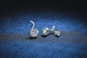 Macro shot of S925 sterling silver S-curve earrings with one-carat moissanite stones