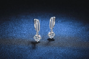 Macro shot of S925 sterling silver drop earrings with four-prong 1-carat moissanite