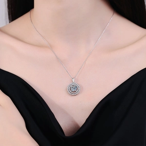Luxurious S925 sterling silver necklace with a 2-carat D-color Moissanite pendant on a model