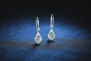 Macro shot of S925 silver pear-shaped drop earrings with brilliant round cut moissanite