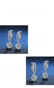 Detail of s925 silver hoop earrings featuring a 4-claw set 1 carat moissanite solitaire
