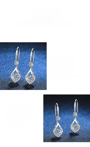 Macro shot of S925 silver teardrop earrings with 1-carat moissanite and polished finish