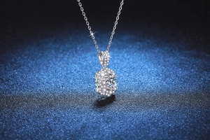 Macro view of S925 silver necklace pendant featuring sparkling egg-shaped moissanite stone
