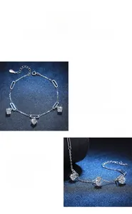 Macro shot of polished S925 silver bracelet featuring sparkling Moissanite charms