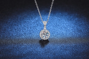 Macro shot of s925 silver halo pendant necklace with 1 carat round cut moissanite