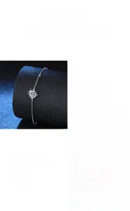 Close-up of a sparkling 1-carat moissanite stone set in a classic four-prong S925 silver chain